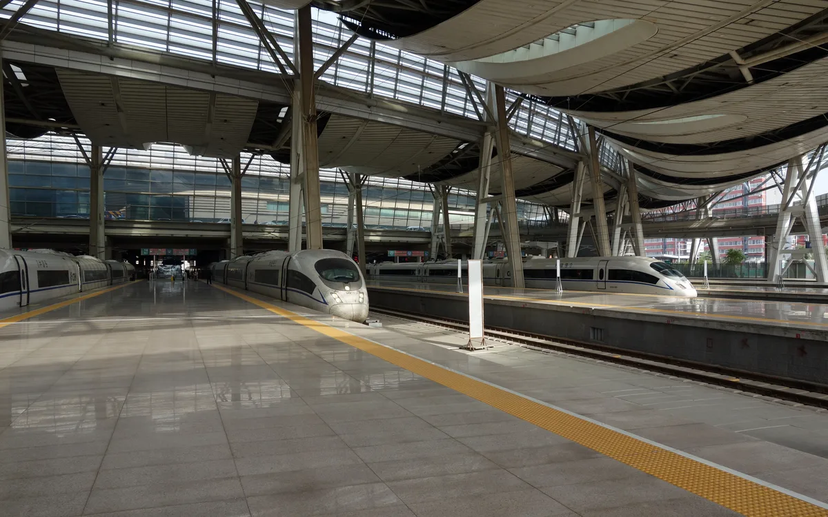 High-speed trains at platforms under the roof of Beijing South Railway Station