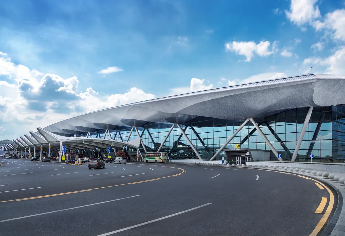 Entrance roadway and curved roof of Guangzhou Baiyun International Airport Terminal 2