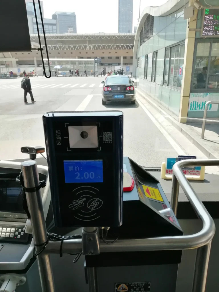 A fare reader on a Shanghai bus, with a scan area and a fare of 2 yuan