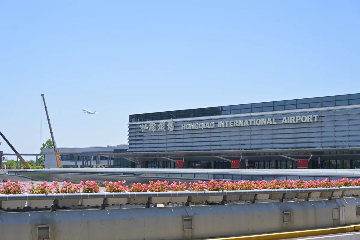 Terminal 1 at Shanghai Hongqiao International Airport, with the airport name on the facade