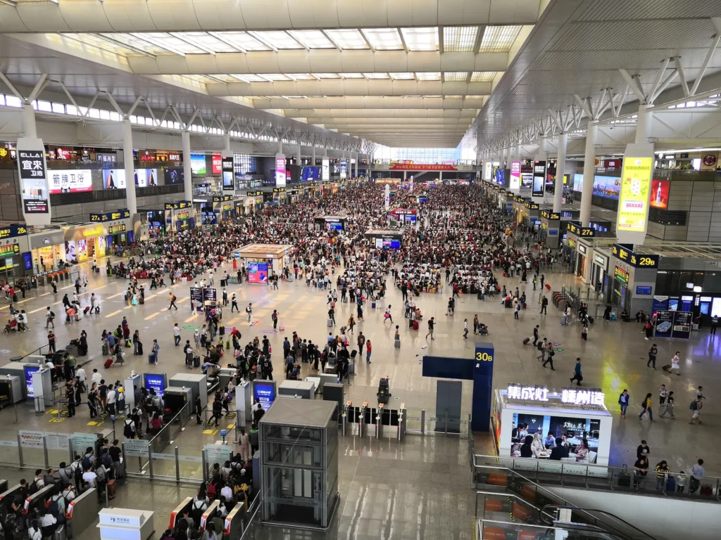 The waiting hall at Shanghai Hongqiao railway station, with crowds and departure gates
