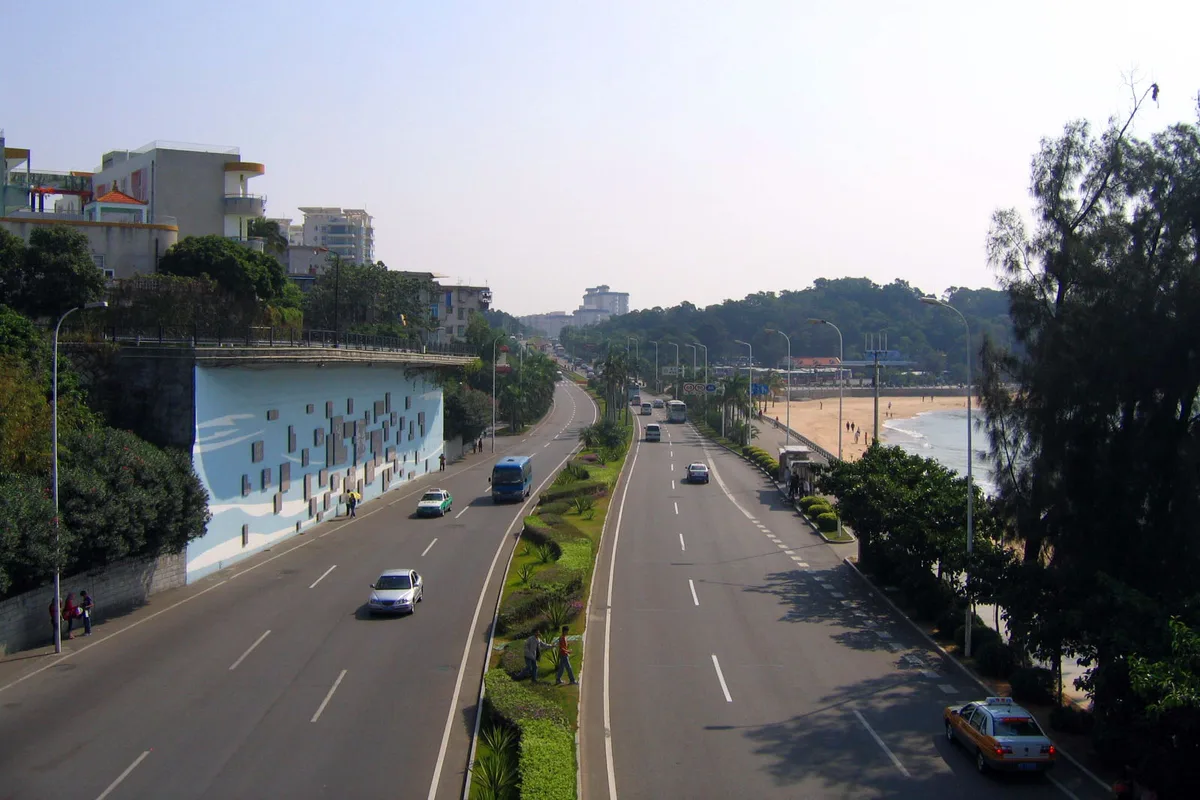 Huandao Road curving along Xiamen Island with beach and sea on one side